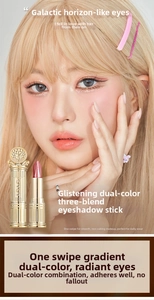 Close-up of dual-color gradient eyeshadow stick with pearlescent shimmer and glitter