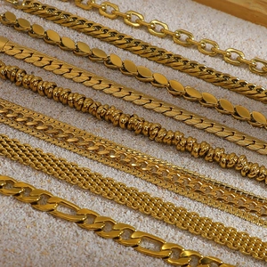 Variety of 18K gold plated stainless steel bracelets on elegant stone background