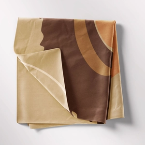 Close-up of bohemian tapestry fabric with vintage geometric patterns and soft woven texture