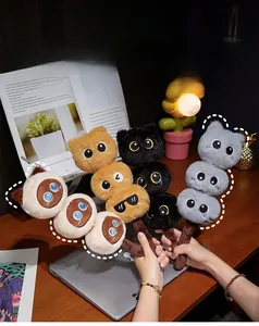 Macro shot of cute plush cat marshmallow stick toys in assorted colors and soft fabric