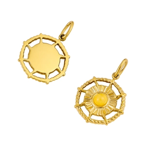 Macro detail of round stainless steel pendant with sunburst engraving and yellow stone