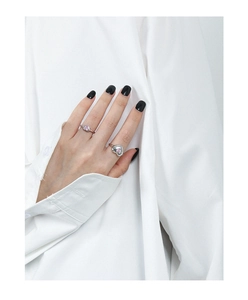 Close-up of pink heart-shaped zircon stone on a 925 sterling silver minimalist ring