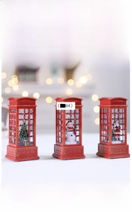 Detailed view of LED Christmas phone booth lanterns with Santa and snowman figurines