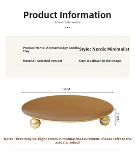 Close-up of Nordic iron candle tray in matte gold finish with sphere ball base