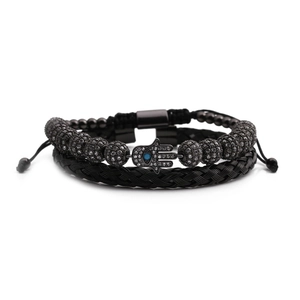 Detailed shot of Hamsa Hand beaded bracelet and woven band set with blue zircon