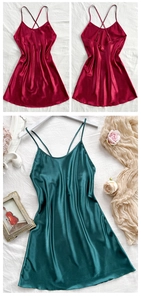 Lustrous satin sleepwear detail featuring delicate cross-back straps and silky texture