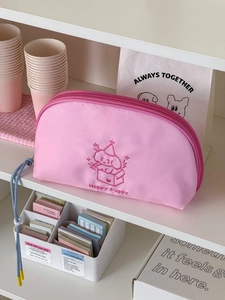 Pink semi-circle makeup bag with happy puppy embroidery and blue handle for organization