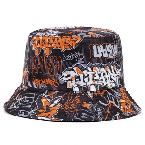 Close-up of urban graffiti patterns and fabric texture on a street art bucket hat