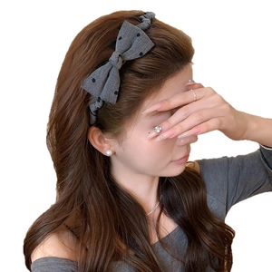 Gray polka dot bow headband for women featuring a stylish high-top fabric hair accessory