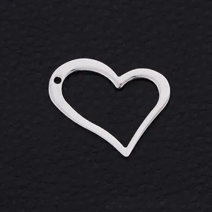Polished silver hollow heart-shaped stainless steel pendant on black leather background