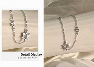 Detail display of silver star bracelet with hollow metal and sparkling crystal pavé charms