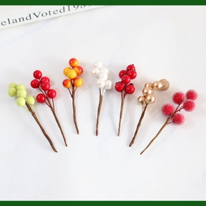 Detailed set of artificial decorative berries in seven colors on marble surface