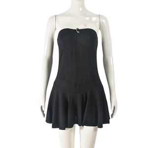 Detail of black ribbed knit off-shoulder mini dress on white mannequin stand