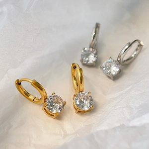 Close-up of gold and silver plated hoop earrings with brilliant round cubic zirconia