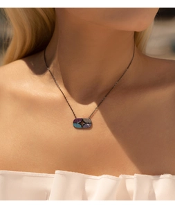 Close-up of S925 silver hollow star necklace with colorful gems on model neck