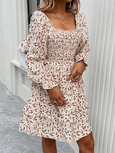 Detail of floral print dress with square neck, long ruffled sleeves and elastic high waist