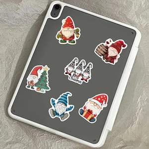 50pcs waterproof Christmas gnome stickers on tablet showing Merry Christmas design