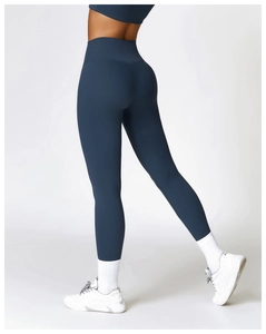 Detail shot of high-waist navy yoga leggings showing seamless hip-lifting fit and texture