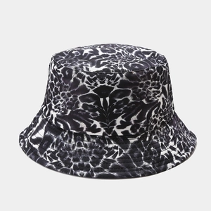 Detail of graffiti print bucket hat showing fine stitching on the brim and canvas texture