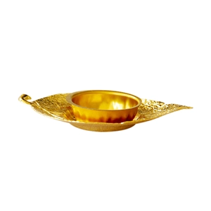 Golden metal incense burner with leaf-shaped tray and embossed texture for home decor