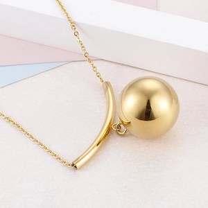 Elegant gold stainless steel beaded necklace with curved tube pendant on pastel background