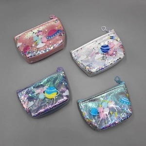 Detail of multi-color holographic space-themed makeup pouches with heart zipper pulls