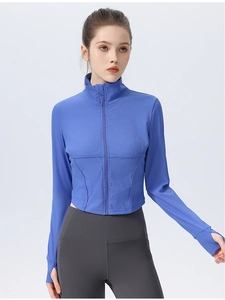 Close-up of blue yoga jacket featuring a stand collar zipper and thumbhole cuffs