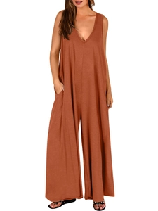 Detail view of burnt orange sleeveless jumpsuit with V-neckline and side pockets