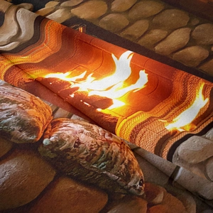 Close-up of realistic fireplace flame print on bohemian wall tapestry fabric texture