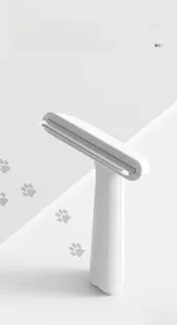 Detail of pet comb featuring thickened stainless steel dense teeth for effective deshedding