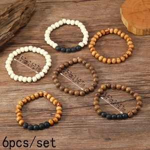 Detailed view of 6pcs set elastic beaded bracelets with natural wood and lava stone beads