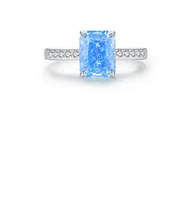 Macro view of square emerald cut light blue zircon ring with small side diamonds