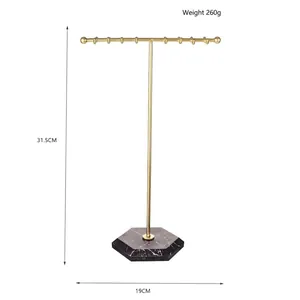 Golden T-shaped jewelry stand with dark marble hexagonal base and size dimensions