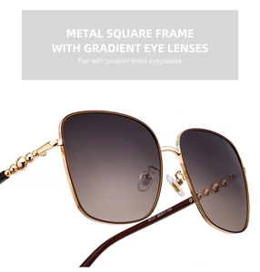 Detail der quadratischen Gold-Sonnenbrille mit Verlaufsgläsern und Größenmarkierungen