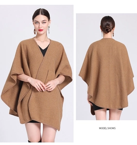 Front and back view of a brown knit poncho shawl for women with soft fabric texture