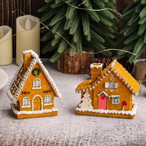 LED lighted Christmas gingerbread resin house with warm snow frosting and holiday trees
