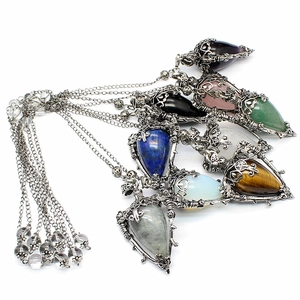 Set of eight assorted gemstone teardrop pendants including amethyst and obsidian on silver chains
