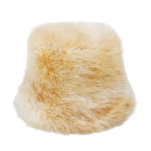 Detailed close-up of fluffy apricot faux mink bucket hat showing soft plush texture