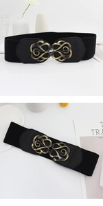 Detail of black elastic wide belt featuring a vintage gold hollow carved metal buckle