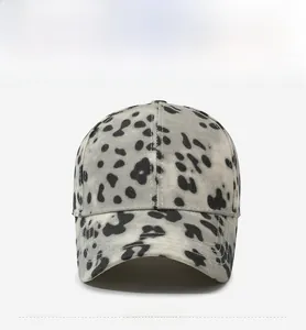 Front view of leopard print baseball cap with black and white animal pattern and curved brim