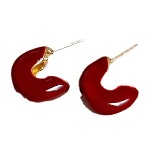 Minimalist red enamel C-shaped hoop earrings with polished gold-plated metal finish