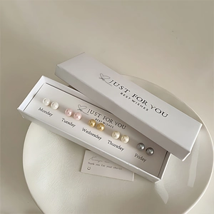 5-pair pearl stud earring gift set in white box with weekly labels from Monday to Friday