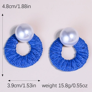Blue raffia woven circular earrings with white pearl detail and dimensions 4.8x3.9cm