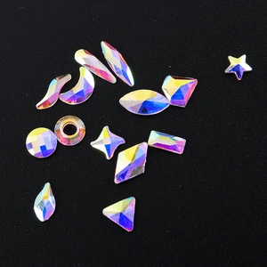AB aurora flatback crystal rhinestones in mixed shapes on a black background for nail art