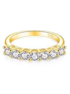 Macro detail of S925 sterling silver ring with seven sparkling white zircons and gold plating