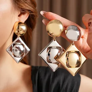 Modern geometric hollow diamond earrings with metallic round accents in gold and silver finish