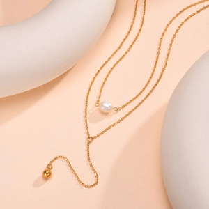 Double-layered golden stainless steel necklace with white pearl and polished metal bead