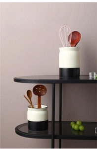 Detail of Nordic black and white ceramic kitchen tool holder for whisk and spoons