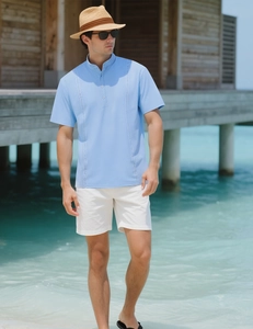 Detail of light blue striped polo shirt with ribbed texture and three-button placket