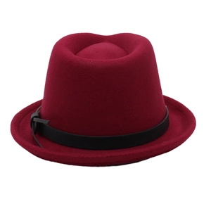 Detail of burgundy wool felt jazz hat featuring a black leather band and fedora crown style